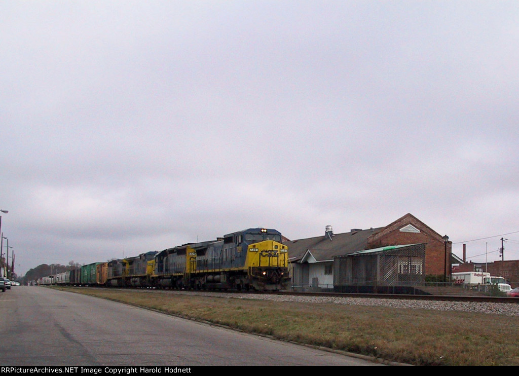 CSX 7391 leads a southbound train past the old station